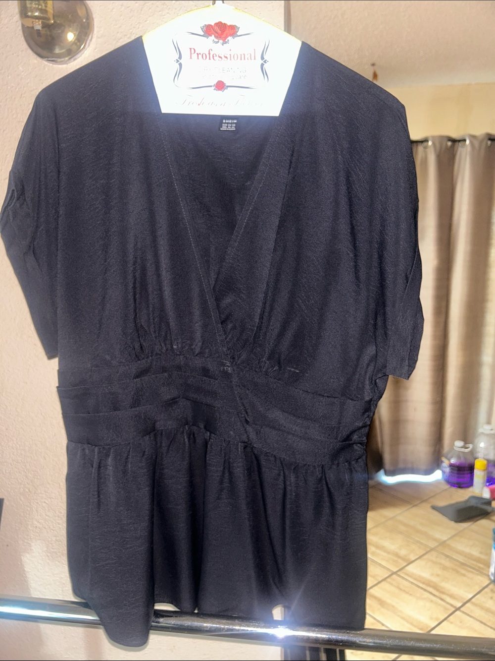 SHEIN Black V-Neck Women’s Top with Elastic Waist on the back.
